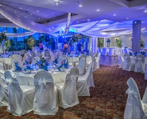 Blue and white themed reception ballroom with draped ceiling