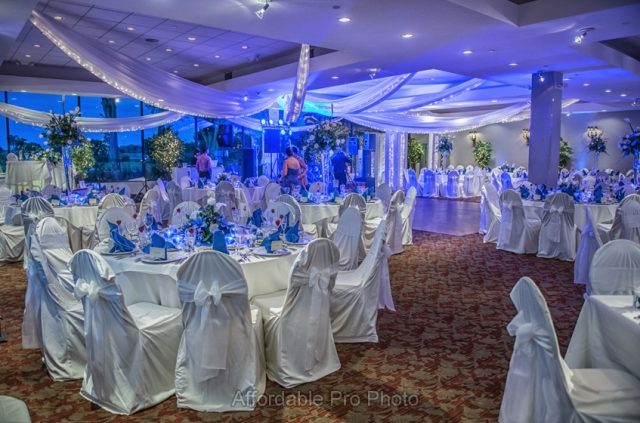Blue and white themed reception ballroom with draped ceiling