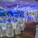 Blue and white themed reception ballroom with draped ceiling