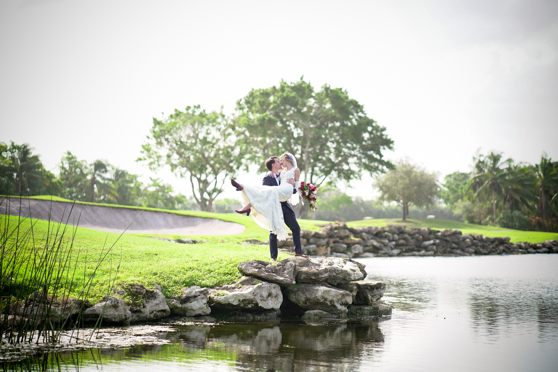 A couple at a bank of lake