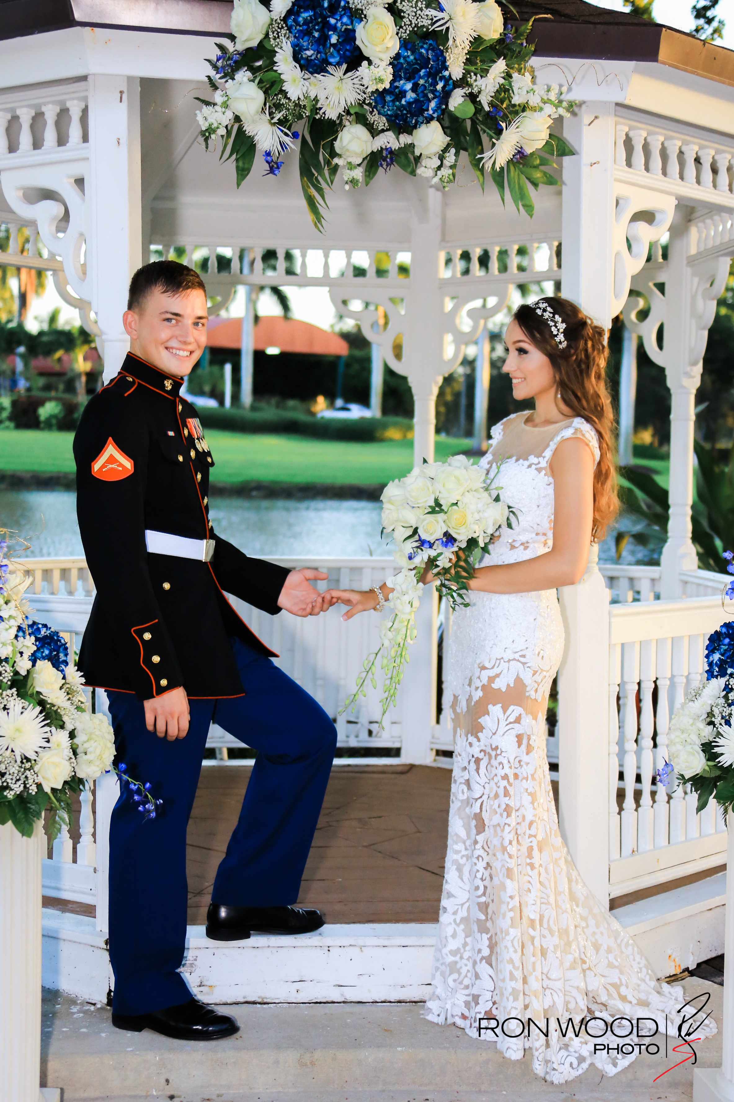 A bride with a flower bouquet and a groom