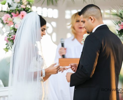 Bride and groom exchanging rings during their wedding ceremony