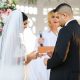 A groom and bride wearing rings