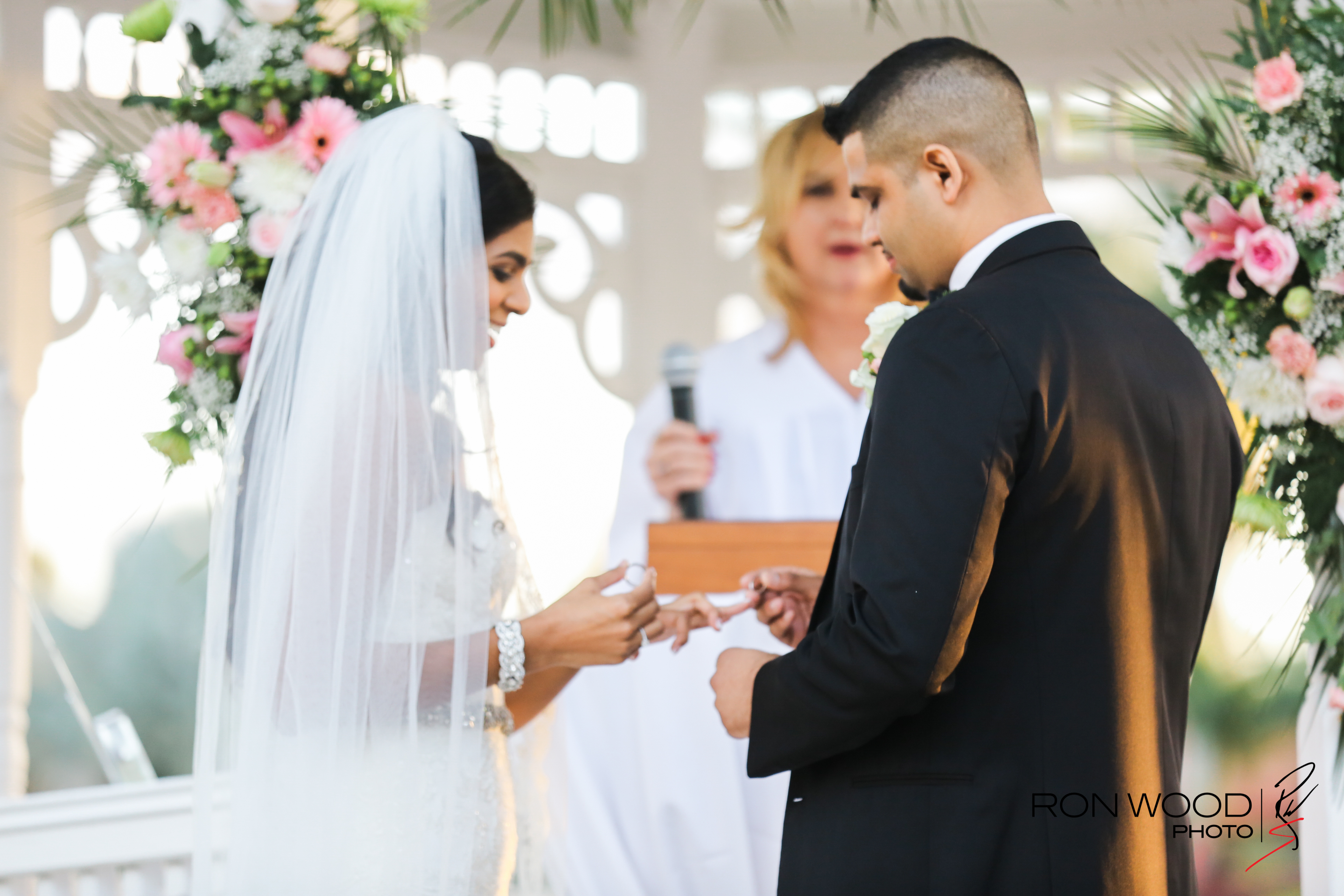A groom and bride wearing rings