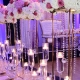 Flower bouquet stands on a dinning table with candles